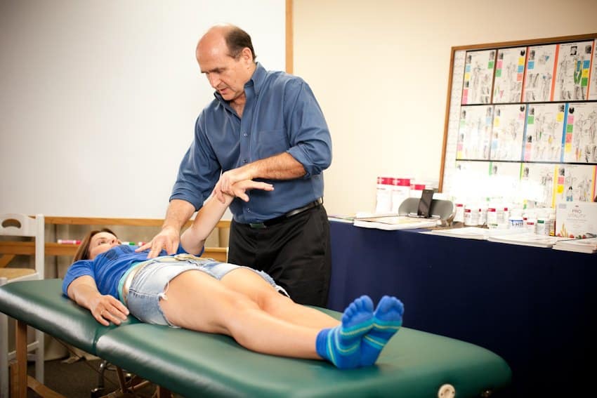 John Maguire instructing student