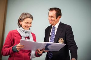 dr deal and woman looking at book